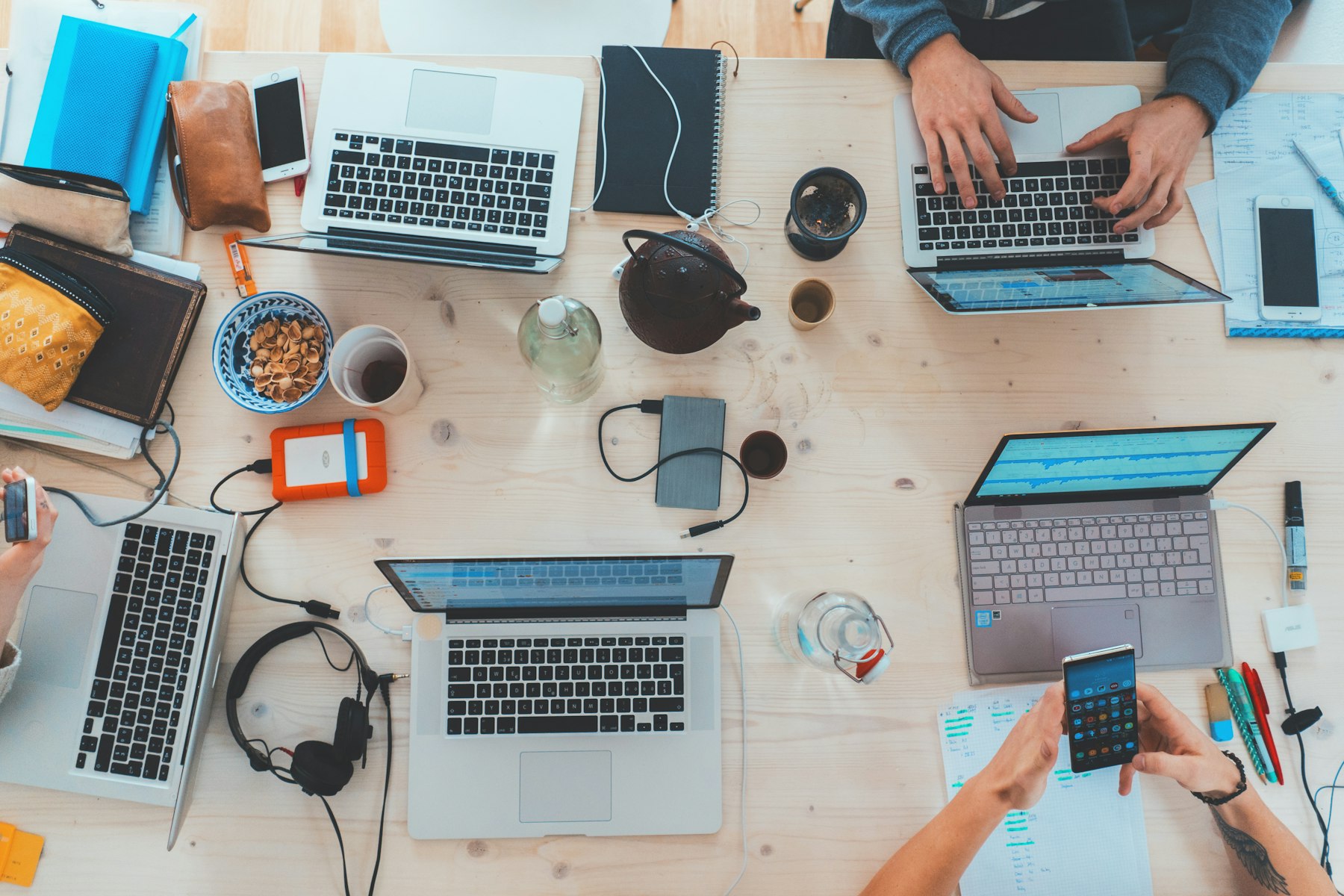 A team at a table with laptops
